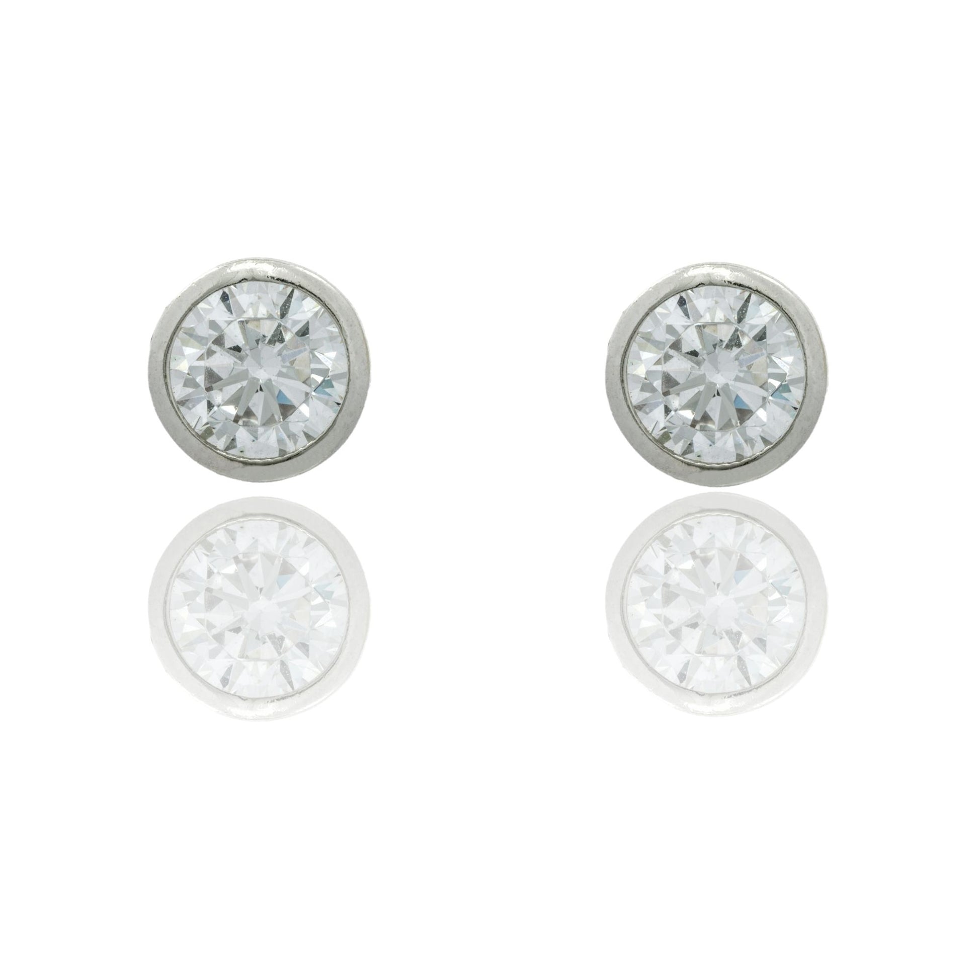 Orecchini Oro Bianco Oro 18 carati Punto Luce Con Contorno Lucido Zirconi Bianchi